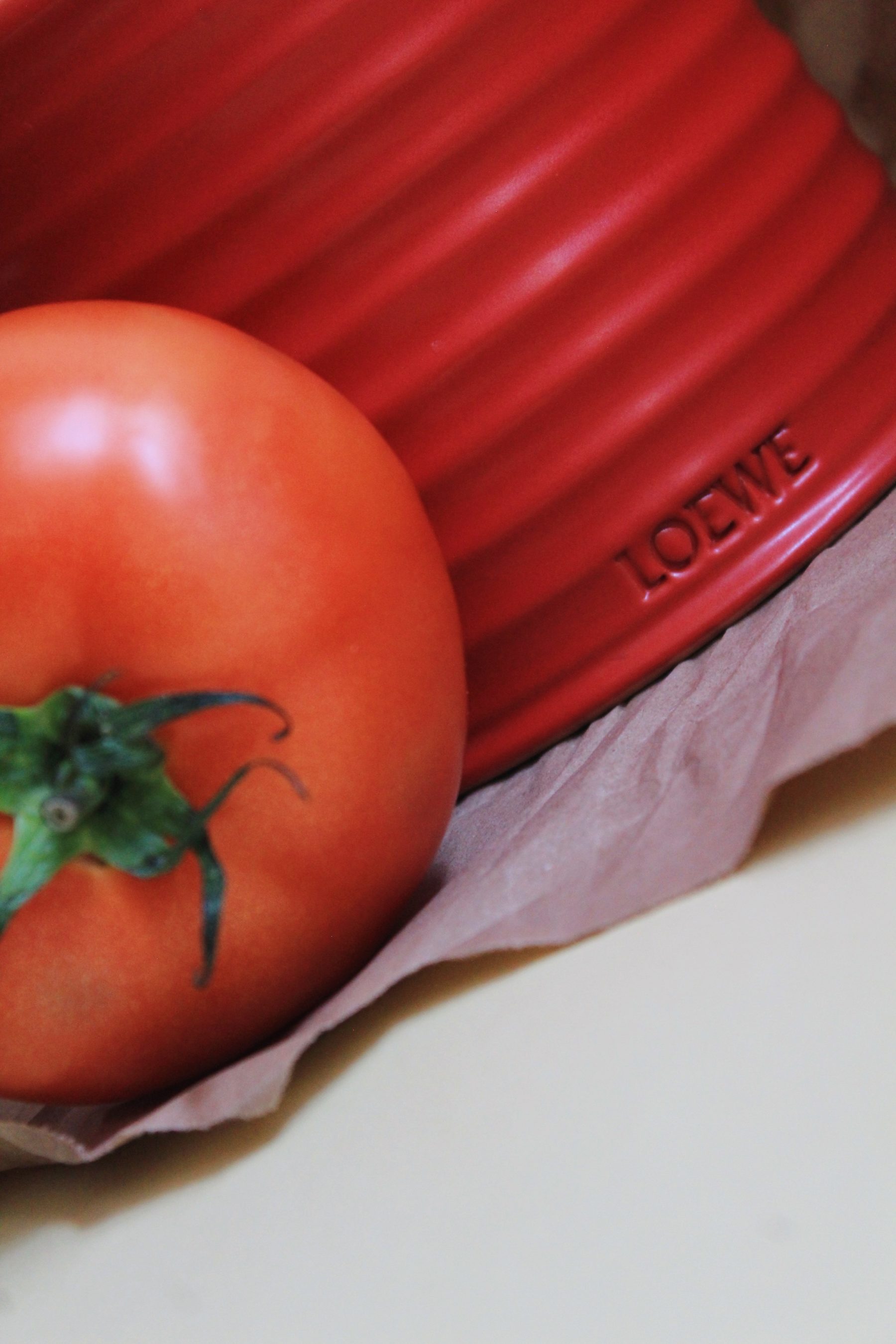 When butter yellow meets red tomato leaves by LOEWE